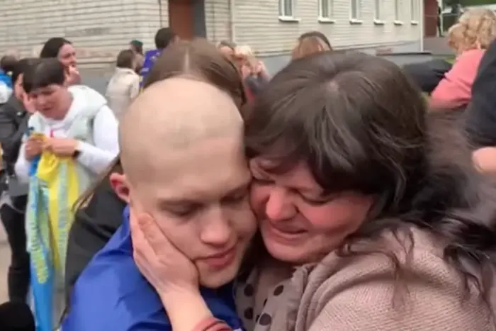 Meeting of a soldier with parents after captivity